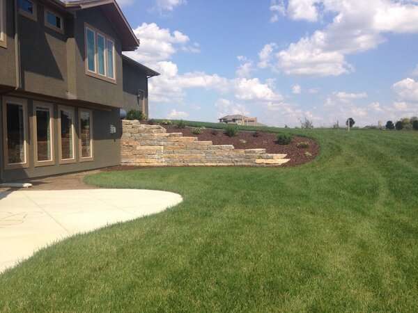 Backyard retaining wall to keep the landscaping in place