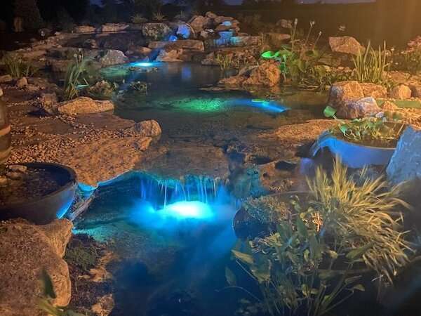 Koi pond with underwater light additions