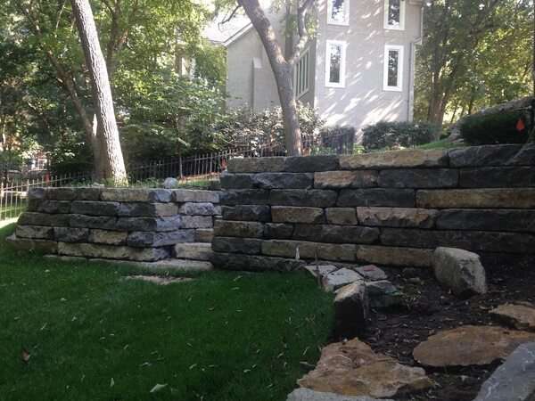 Large stone retaining wall with steps