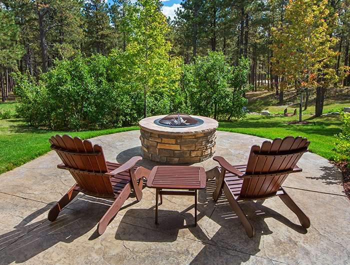 stone patio with built in fire pit