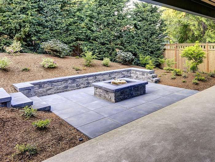 natural stone paver patio with built in fireplace