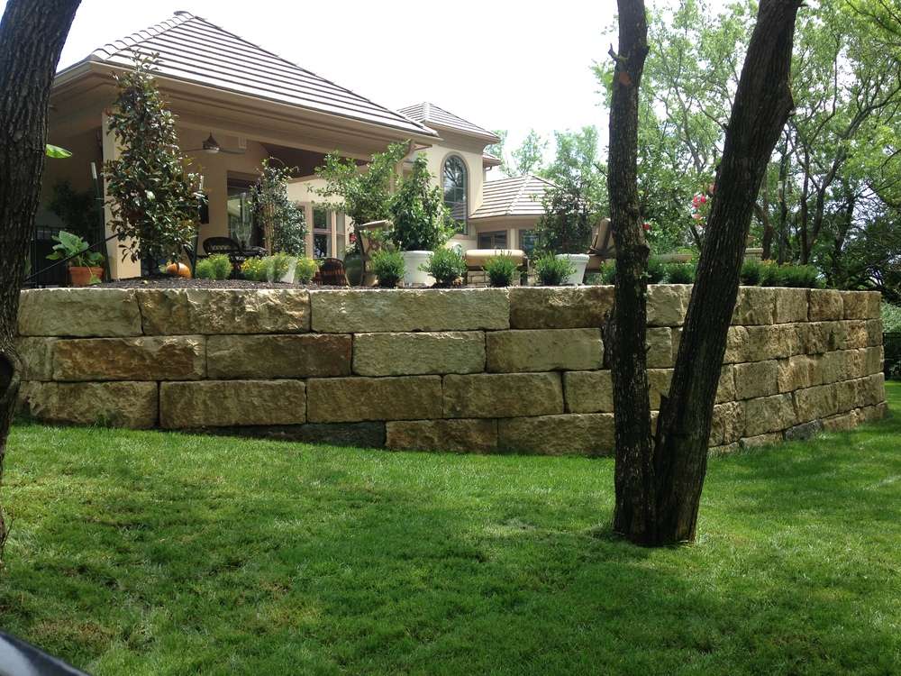 Stone Retaining Wall Next To Garden